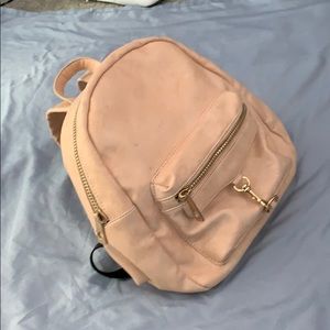 Lightly used stylish backpack, gold and cream.